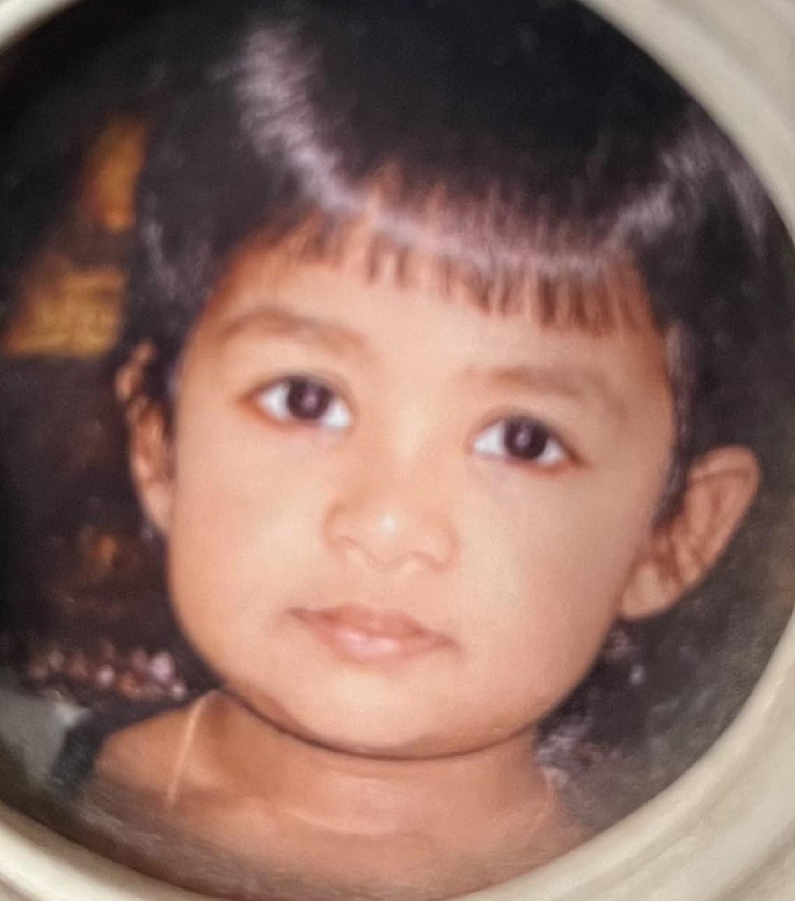 Baby Kaysh in a circular framed photo