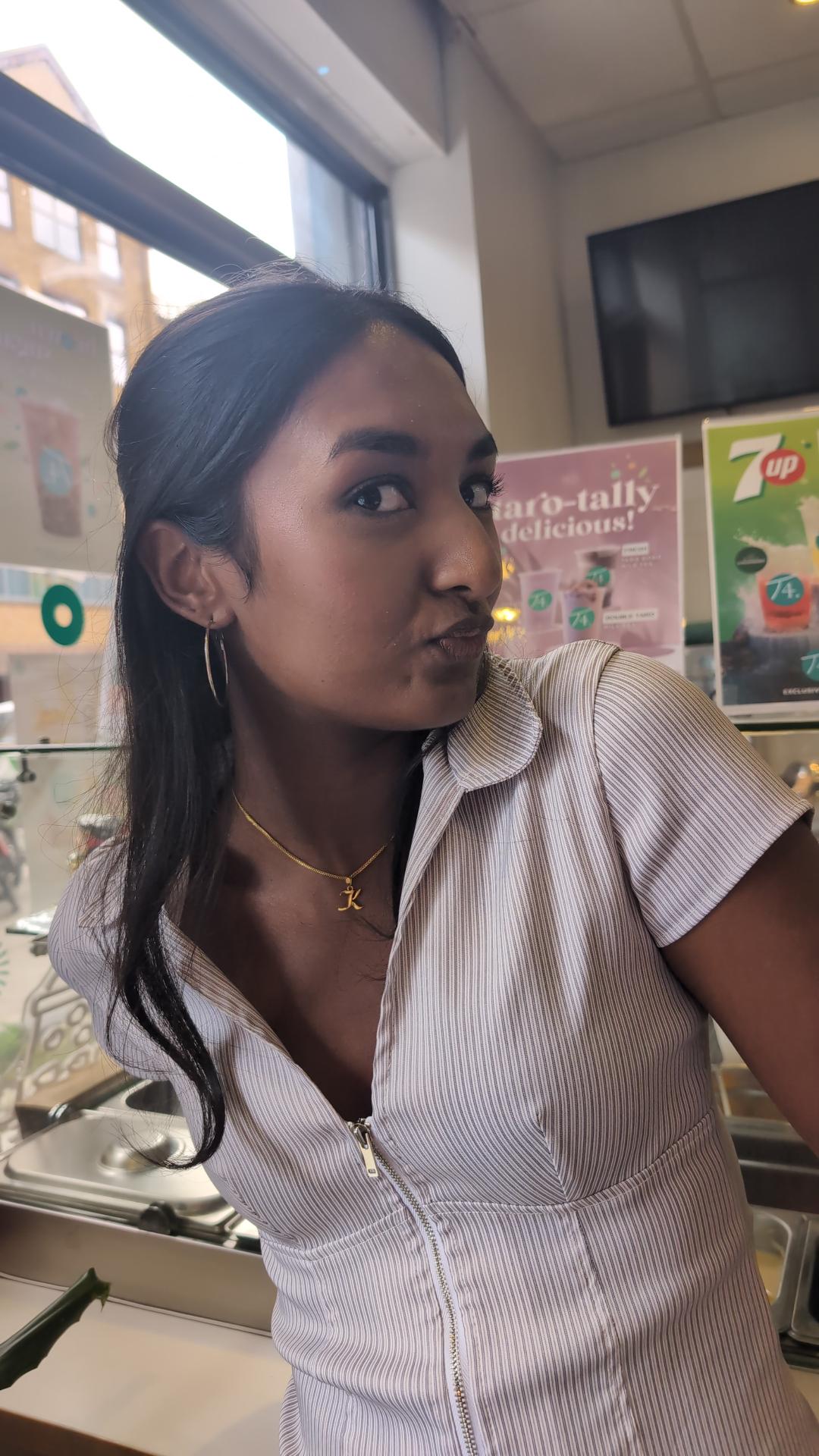 Kaysh pulling a face at a bubble tea shop
