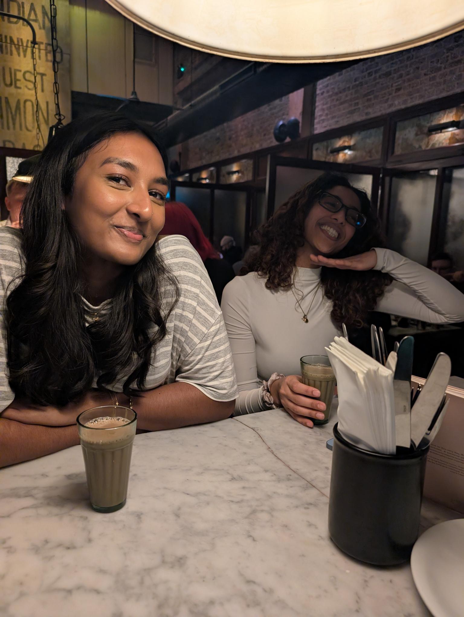 Kaysh and a friend sharing chai at a restaurant